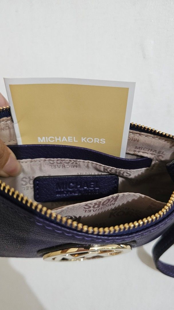 Michael Kors Purple Leather Wristlet Pouch (Category: Purses & Pouches) located in Paranaque City. Submitted by ashmvc (Listing ID 1447376450, Image 3). Description: - Purple Michael Kors wristlet (super nice color!) - Includes original tags - Bought from the US, retails for around $40 - RFS: Decluttering, need funds for vet bills MOP: BPI and GCash Meet ups at SM Bicutan and SM Light. Delivery available, fee to be shouldered by buyer.