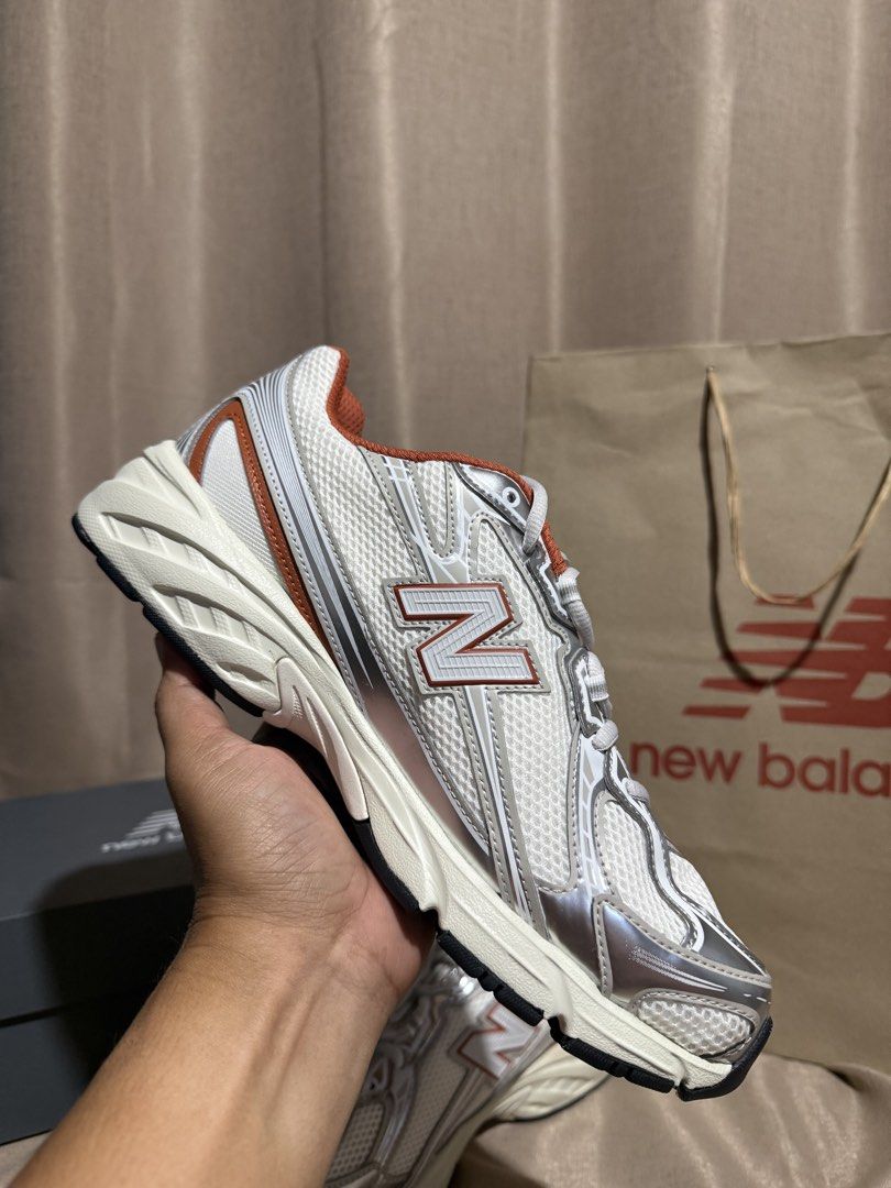 New Balance 740 White Silver Orange Sneakers (Category: Sneakers) located in Tagum. Submitted by SCKFTStreetwear_2019 (Listing ID 1447392221, Image 3). Description: - Brand: New Balance - Model: 408 - Color: White with silver and orange accents - Features: Breathable mesh upper, comfortable chunky sole - Condition: Comes with original box and bag - Ideal for: Everyday wear, light workouts.