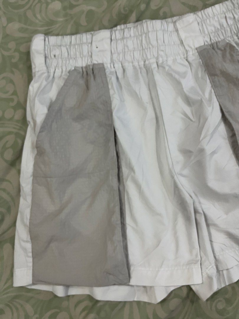Nike White & Grey Athletic Shorts XL (Category: Shorts) located in Batangas. Submitted by gavsandrix (Listing ID 1447408712, Image 2). Description: - Nike athletic shorts - Color: White with grey panel details - Size: XL - Features: Elastic waistband for comfort - Origin: Made in Vietnam - Ideal for: Workouts or casual wear.