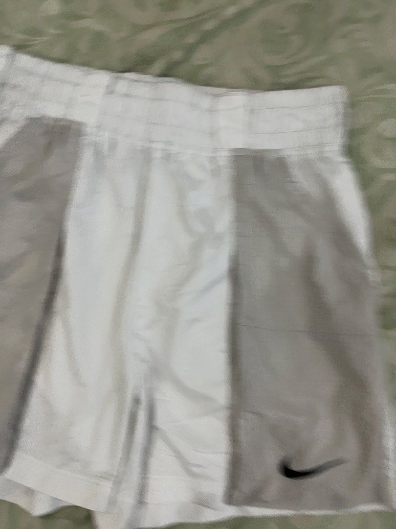 Nike White & Grey Athletic Shorts XL (Category: Shorts) located in Batangas. Submitted by gavsandrix (Listing ID 1447408712, Image 3). Description: - Nike athletic shorts - Color: White with grey panel details - Size: XL - Features: Elastic waistband for comfort - Origin: Made in Vietnam - Ideal for: Workouts or casual wear.