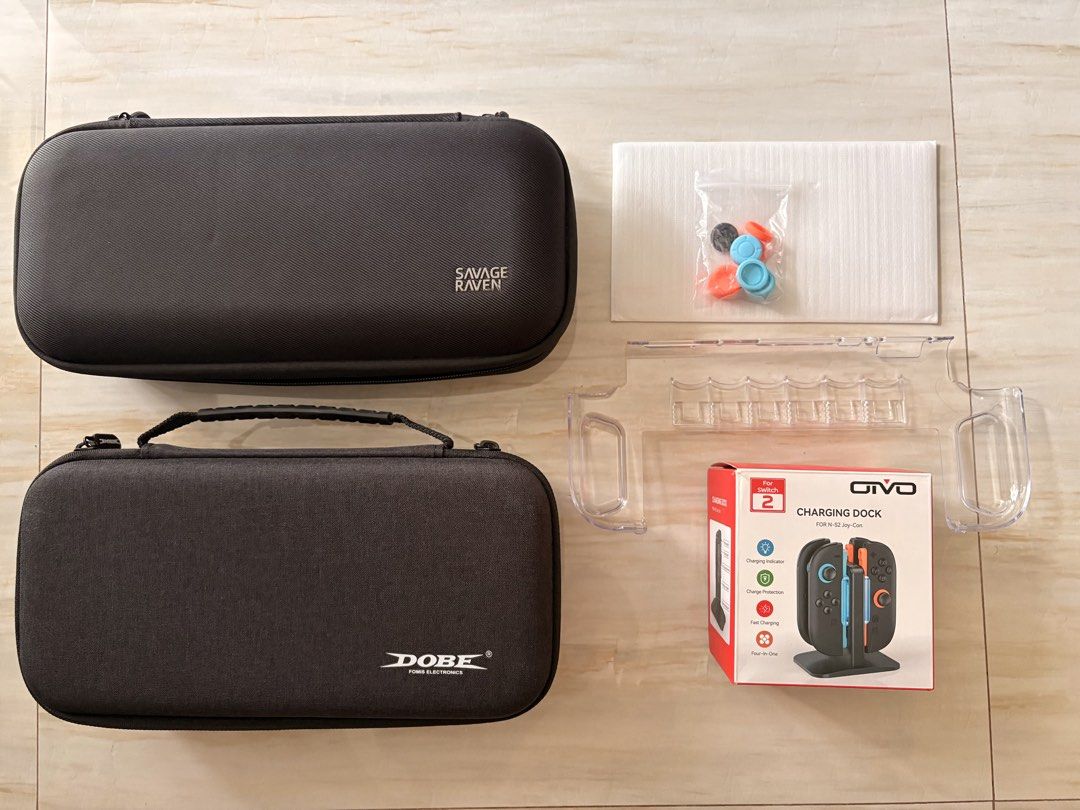 Nintendo Switch Carrying Cases, Charging Dock & Accessories (Category: Nintendo) located in Manila. Submitted by mrwick3386 (Listing ID 1447310920, Image 1). Description: For Sale: Nintendo Switch 2 case - Savage Raven - Dobe - Screen protector - thumb grips - Nintendo Switch 2 holder All in 1,500 .