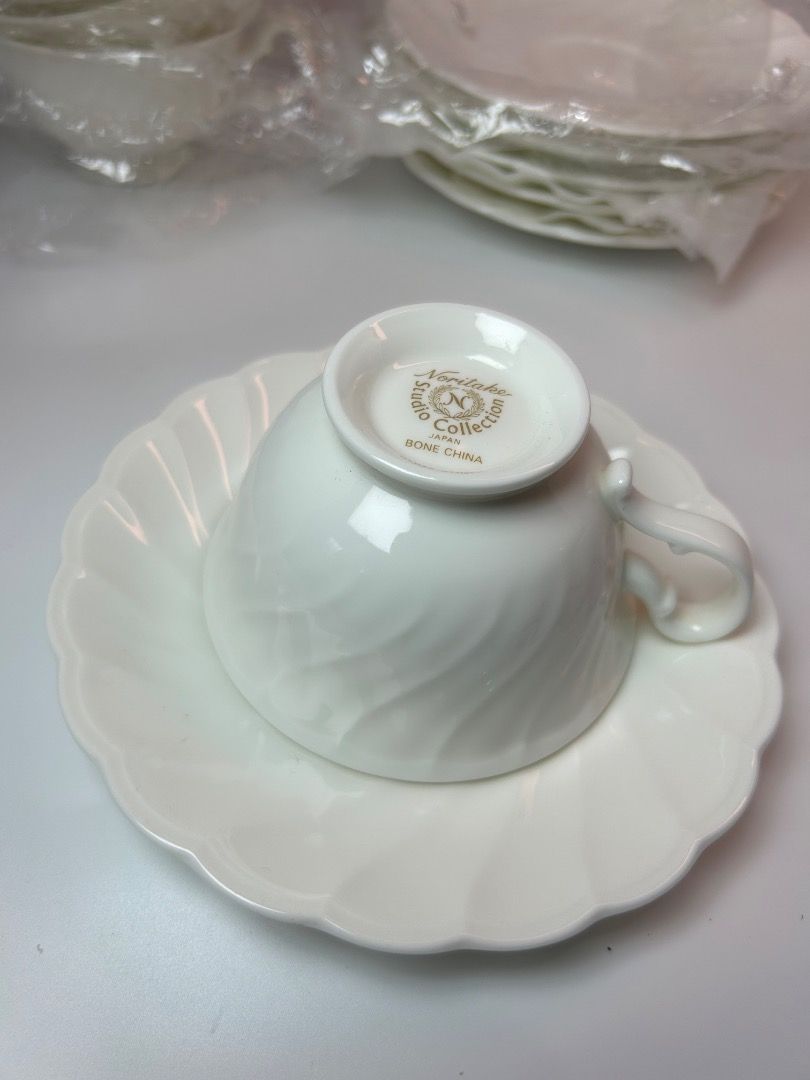 Noritake Studio Collection Bone China Tea Cups & Saucers (Category: Coffee & Tea Tableware) located in Taguig. Submitted by Rare_findsmnl (Listing ID 1447467675, Image 3). Description: Brand new Noritake Studio Collection ₱500 per duos ₱2700 for 6 duos. H2.5” D 3.8” Set of Noritake Studio Collection tea cups and saucers - Made of fine bone china - Elegant white with a subtle swirled design - Some cups remain in their original plastic packaging - 