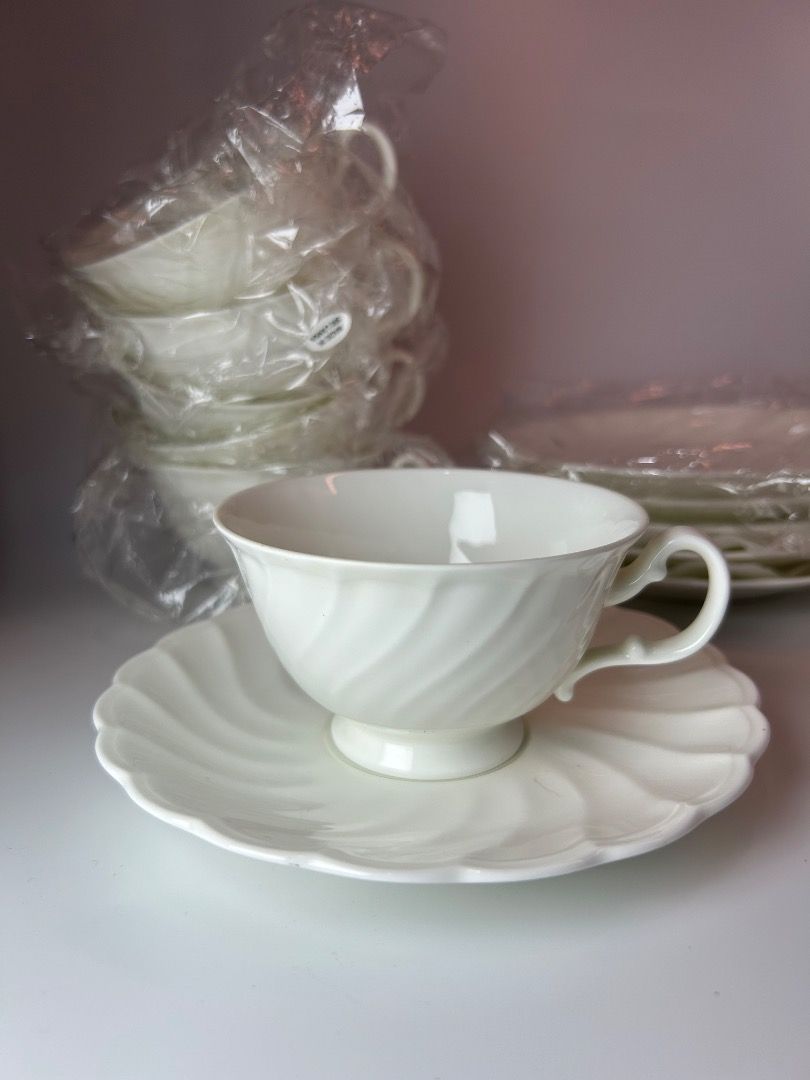 Noritake Studio Collection Bone China Tea Cups & Saucers (Category: Coffee & Tea Tableware) located in Taguig. Submitted by Rare_findsmnl (Listing ID 1447467675, Image 2). Description: Brand new Noritake Studio Collection ₱500 per duos ₱2700 for 6 duos. H2.5” D 3.8” Set of Noritake Studio Collection tea cups and saucers - Made of fine bone china - Elegant white with a subtle swirled design - Some cups remain in their original plastic packaging - 