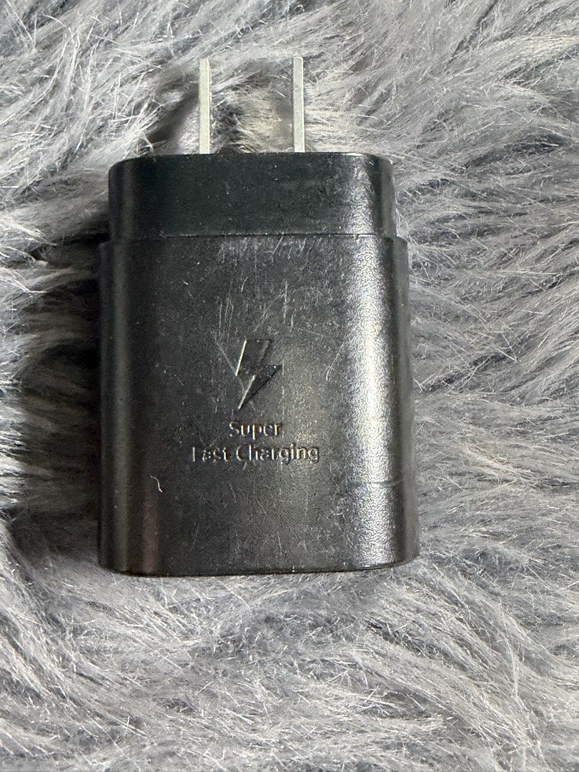 Original Samsung Charger Adaptor (Category: Chargers & Cables) located in Quezon City. Submitted by angelannedc (Listing ID 1447320327, Image 2). Description: Original Samsung Adaptor 25W With Box 6months old Bought in Samsung Store Original Price: ₱1,499 It has a few scratches (See in the picture) RFS: Bought 45W.