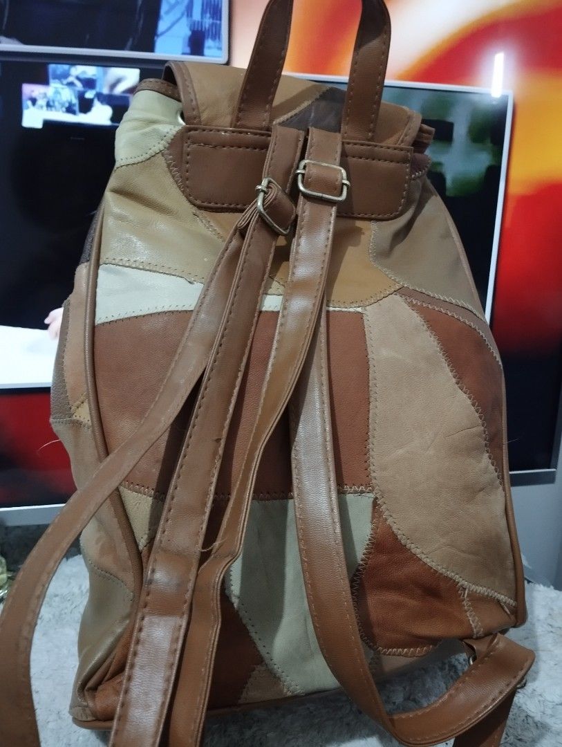 Patchwork Leather Backpack (Category: Backpacks) located in Manila. Submitted by beckylafea (Listing ID 1447330165, Image 2). Description: - Cool patchwork leather backpack - Assorted brown and tan shades - Drawstring closure with flap top - Zippered main compartment - Adjustable straps - Unique design - Ideal for everyday use or travel No rips ,no holes ,no bakbak. very clean inside .