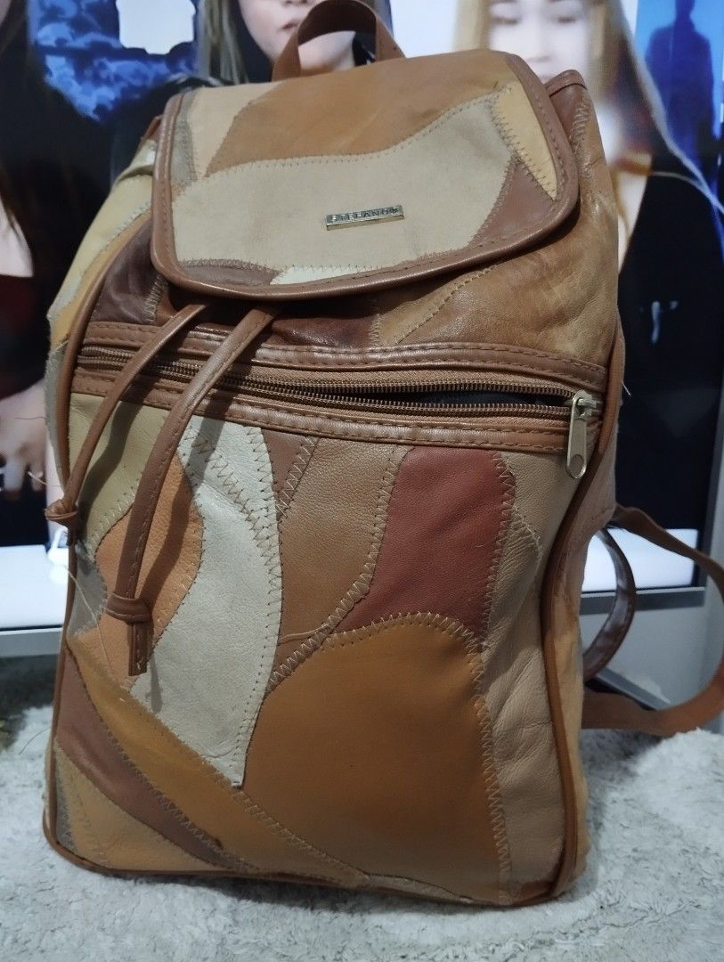 Patchwork Leather Backpack (Category: Backpacks) located in Manila. Submitted by beckylafea (Listing ID 1447330165, Image 1). Description: - Cool patchwork leather backpack - Assorted brown and tan shades - Drawstring closure with flap top - Zippered main compartment - Adjustable straps - Unique design - Ideal for everyday use or travel No rips ,no holes ,no bakbak. very clean inside .
