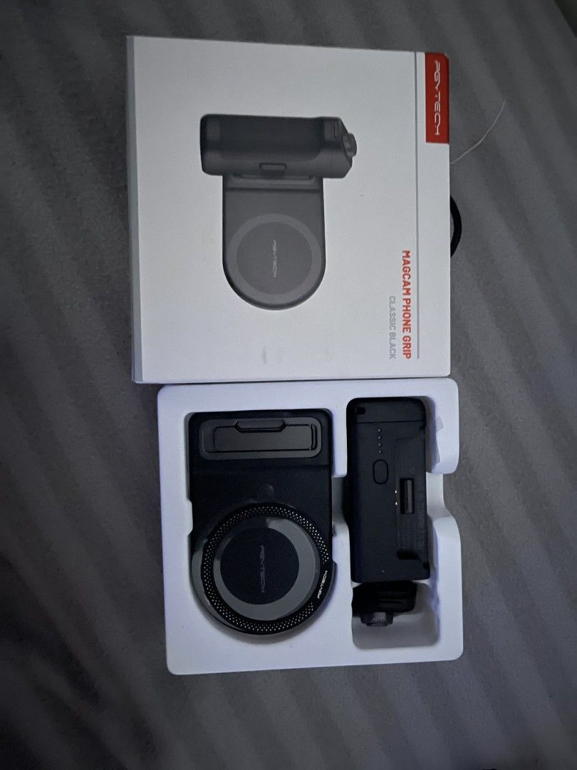 PGYTECH Magcam Phone Grip Classic Black (Category: Mounts & Holders) located in Las Pinas. Submitted by micahannebatas-77317 (Listing ID 1447338019, Image 2). Description: - PGYTECH Magcam Phone Grip in Classic Black - Magnetic phone grip with wireless charging capability - Includes grip and charging base - Enhances phone shot stability - Keeps your phone powered up - Simple to attach and use.