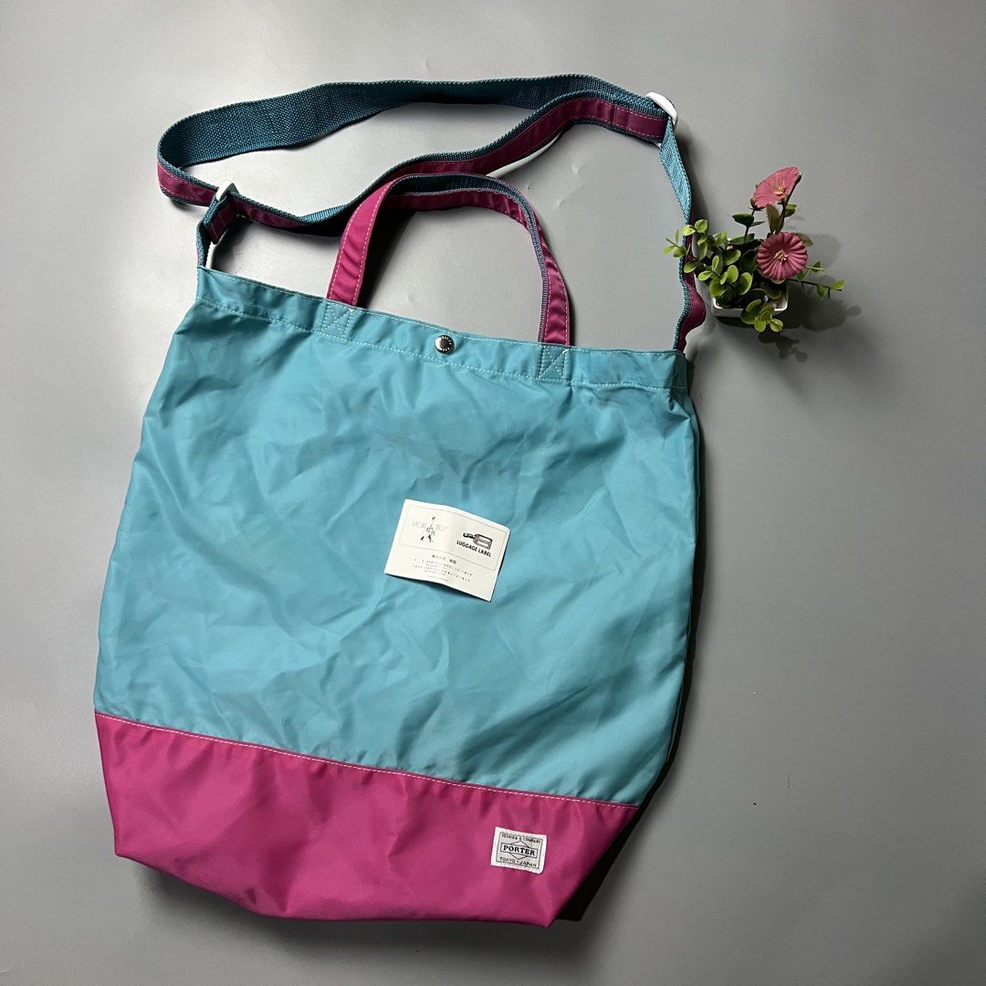 Porter Tokyo Japan Tote Bag (Category: Tote Bags) located in Bago City. Submitted by g___shop (Listing ID 1447404206, Image 2). Description: - Cool Porter tote bag - Teal and pink color block design - Top handles and long crossbody strap - Small snap closure at the top - Made in Japan - Ideal for everyday use or travel.