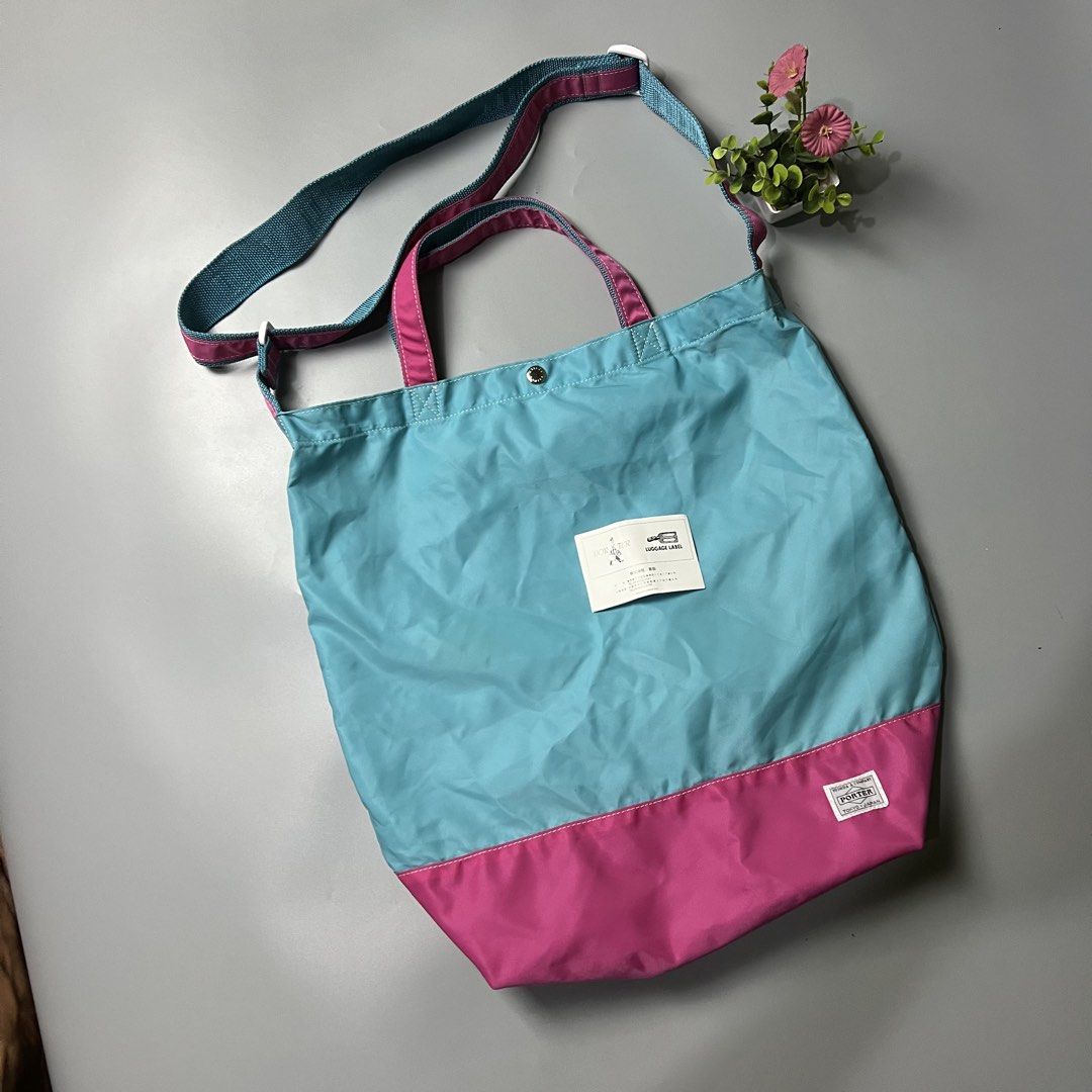 Porter Tokyo Japan Tote Bag (Category: Tote Bags) located in Bago City. Submitted by g___shop (Listing ID 1447404206, Image 3). Description: - Cool Porter tote bag - Teal and pink color block design - Top handles and long crossbody strap - Small snap closure at the top - Made in Japan - Ideal for everyday use or travel.
