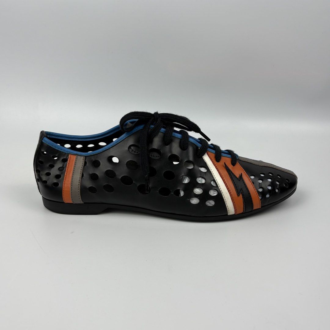 Prada - S/S 16 - Perforated Lightning Bolt Accent Sneakers (Category: Sneakers) located in Bacolod City. Submitted by cast.archives (Listing ID 1447444028, Image 3). Description: Prada - S/S 16 - Perforated Lightning Bolt Accent Sneakers Authentic Runway Piece Condition: Pristine Flaw: Normal sign of used .