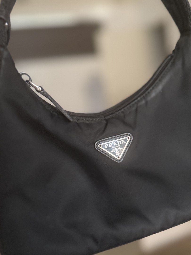 Prada Re-Edition 2000 Nylon Mini Bag Black (Category: Luxury Bags & Wallets) located in Quezon City. Submitted by mommysah (Listing ID 1447365579, Image 2). Description: - Authentic Prada shoulder bag - Model: Re-Edition 2000 - Material: Black nylon - Iconic Prada triangle logo - Leather tag detail - Zipper closure - Small size, ideal for essentials - Woven fabric handle fix price open for meet up fairview.