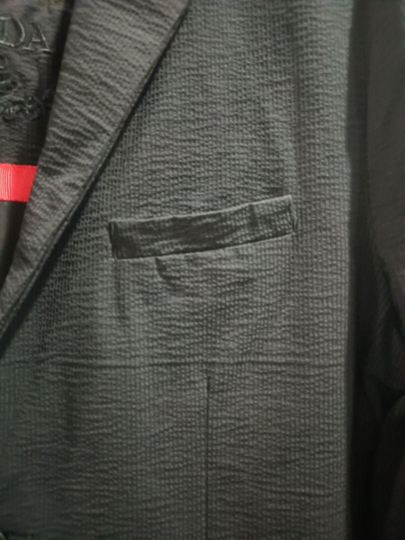 (PRICE DROP) - PRADA SINGLE-BREASTED 2-BUTTON BLAZER (Category: Luxury Apparel) located in Calamba. Submitted by rootsph (Listing ID 1447445620, Image 3). Description: Details: Fits Medium (Slim fit), Fabric is like gusot mayaman. Dimes: 18.5W x 29L Color: Black Condition: Excellent, no issue, cut black wash tags Please manage your expectation, item being sold is preloved and not brand new unless stated otherwise. Major and minor issues will be d
