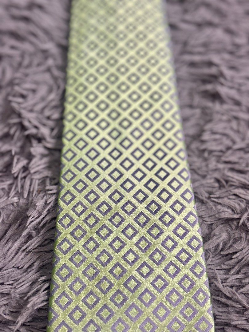 Renoma Paris Necktie fresh premium (Category: Ties) located in Baguio. Submitted by chebaguio06 (Listing ID 1447397728, Image 2). Description: Brand: Renoma Paris – classic quality since 1963 • Design: Soft lime‑green base + subtle silver‑grey diamond grid pattern • Fabric: Smooth fine weave, holds knots neatly & has a nice sheen • Perfect for: Office, church, weddings, graduation or smart casual .