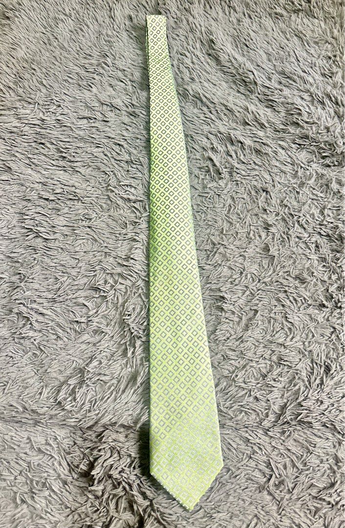 Renoma Paris Necktie fresh premium (Category: Ties) located in Baguio. Submitted by chebaguio06 (Listing ID 1447397728, Image 1). Description: Brand: Renoma Paris – classic quality since 1963 • Design: Soft lime‑green base + subtle silver‑grey diamond grid pattern • Fabric: Smooth fine weave, holds knots neatly & has a nice sheen • Perfect for: Office, church, weddings, graduation or smart casual .