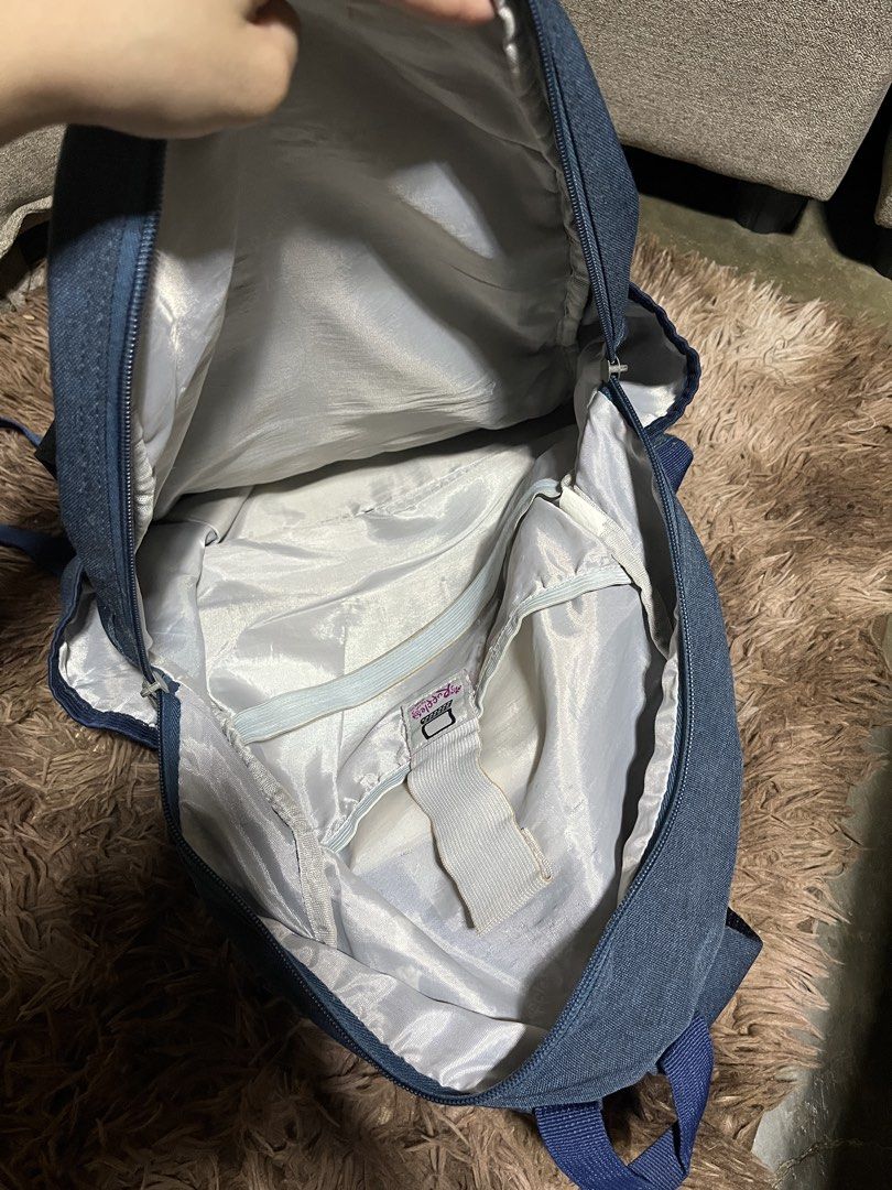 Ruffles Backpack (Category: Backpacks) located in Cavite. Submitted by micole. (Listing ID 1447462629, Image 3). Description: - 8/10 condition - pwede for kids - signs of usage - may stains but matatanggal naman po pag winash. - may sirang zipper (kita sa pic) - also may konting rust sa bottom part na bakal RFS: Decluttering .