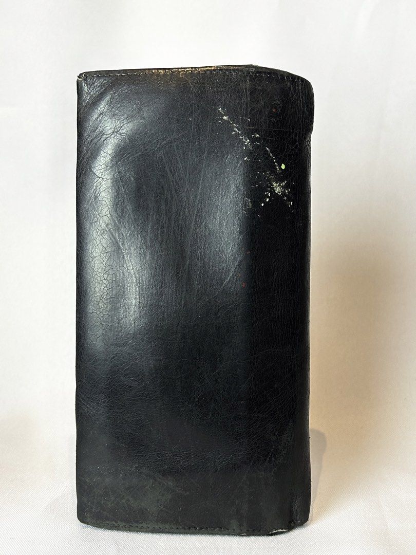 Salvatore Ferragamo Black Leather Long Wallet (Category: Luxury Bags & Wallets) located in Manila. Submitted by originalvintagebagph (Listing ID 1447330609, Image 3). Description: Black leather long wallet from Salvatore Ferragamo. Made in Italy. Features the iconic Gancini clasp. Plenty of card slots and compartments inside. Some signs of wear on the exterior and hardware, as pictured. Still a classic piece..