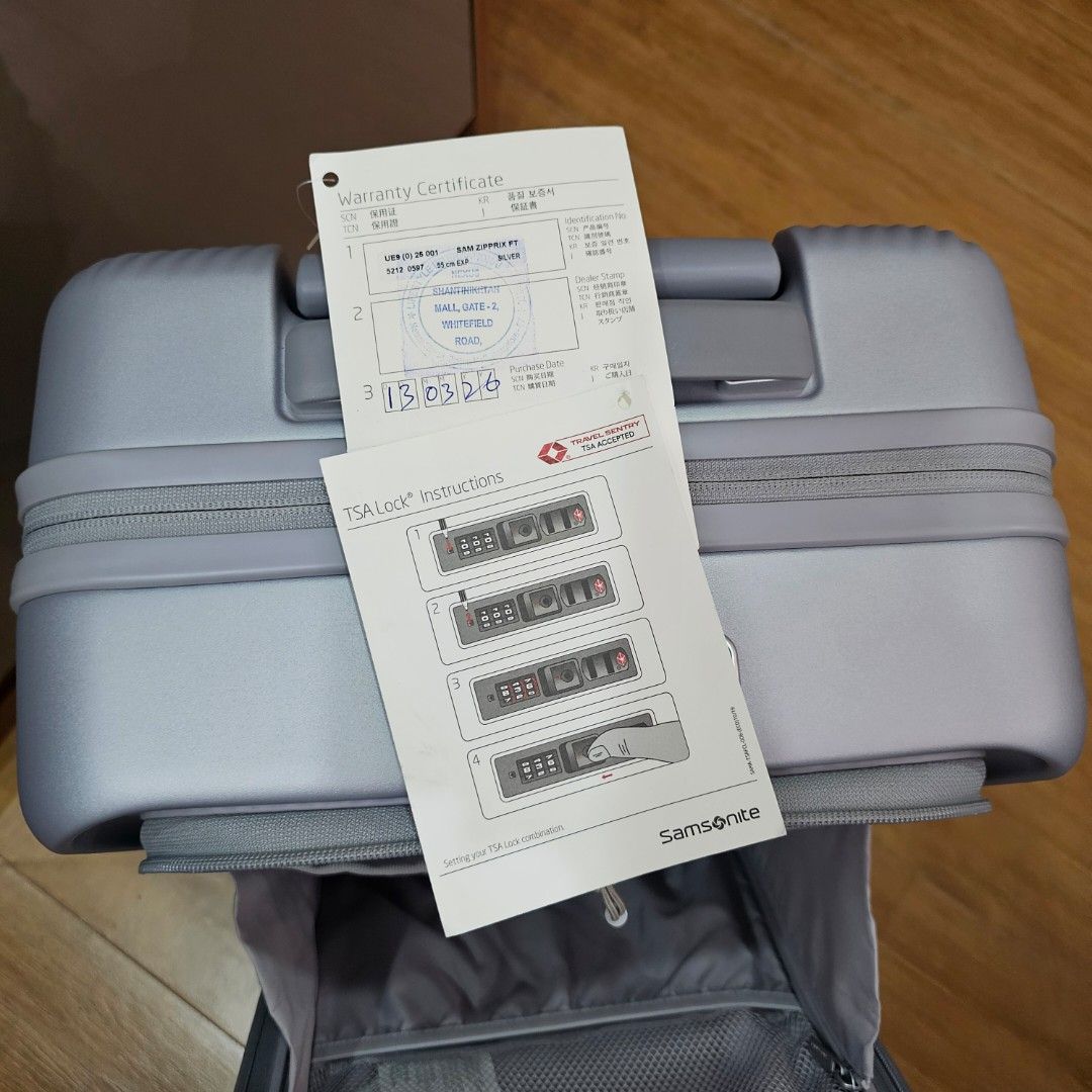 Samsonite Zipprix FT Spinner 55cm Cabin Size Luggage - Silver (Category: Luggage) located in Manila. Submitted by prelovedbyjjl (Listing ID 1447333007, Image 3). Description: - Samsonite spinner luggage - Color: Silver with textured front panel - Security: TSA lock - Capacity: Expandable zipper - Interior: Multiple compartments and straps - Mobility: Smooth rolling wheels and retractable handle - Extras: Comes with warranty certificate and instru