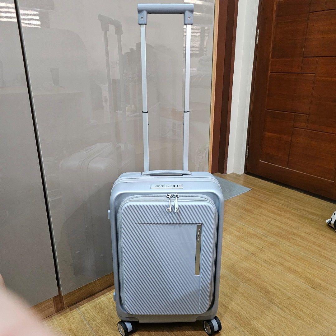 Samsonite Zipprix FT Spinner 55cm Cabin Size Luggage - Silver (Category: Luggage) located in Manila. Submitted by prelovedbyjjl (Listing ID 1447333007, Image 2). Description: - Samsonite spinner luggage - Color: Silver with textured front panel - Security: TSA lock - Capacity: Expandable zipper - Interior: Multiple compartments and straps - Mobility: Smooth rolling wheels and retractable handle - Extras: Comes with warranty certificate and instru