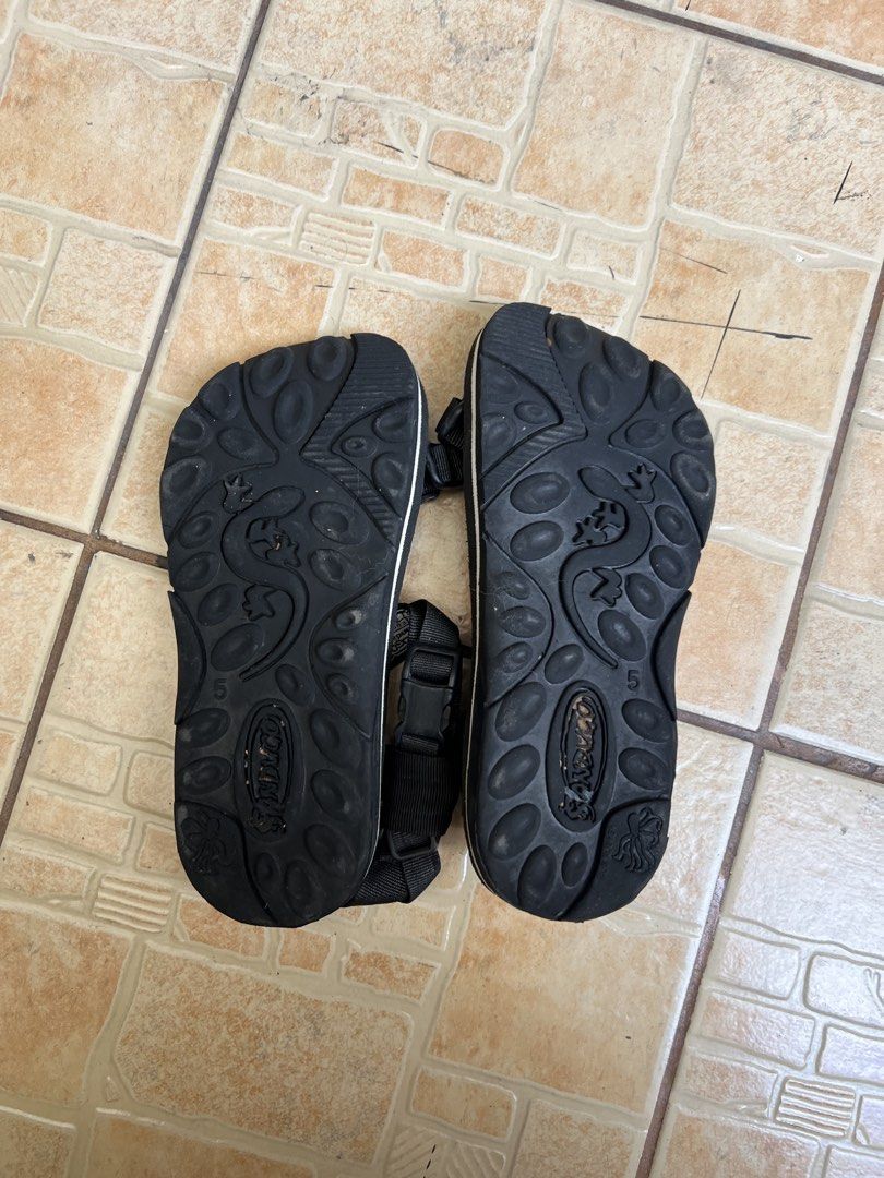 Sandugo Black Adjustable Strap Sandals (Category: Flats & Sandals) located in Caloocan City. Submitted by prelovedbyjuys (Listing ID 1447350705, Image 2). Description: - Black sandugo sandals - Adjustable straps for a perfect fit - Durable sole with excellent grip - Comfortable for walking and everyday wear - Ready for your next adventure! - Use once only.