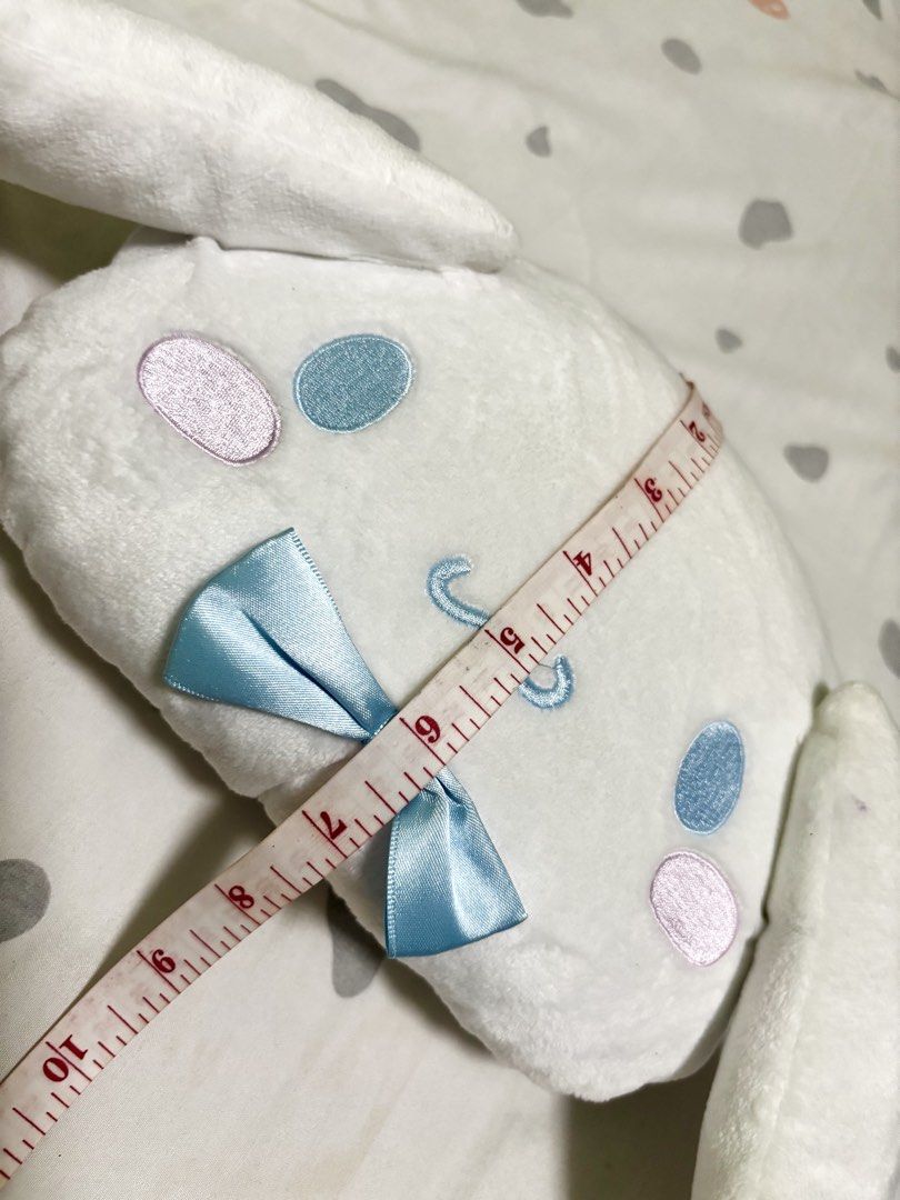 Sanrio Cinnamoroll Plush Shoulder Bag (Category: Babies & Kids Fashion) located in Quezon City. Submitted by pipsqueakscorner (Listing ID 1447427161, Image 3). Description: - Adorable Cinnamoroll plush shoulder bag - Soft white material with embroidered face details - Cute light blue satin bow accent - Light blue fabric lining inside - Features small interior pockets - Secure zipper closure - Approximately 10 inches in length - Ideal for carrying