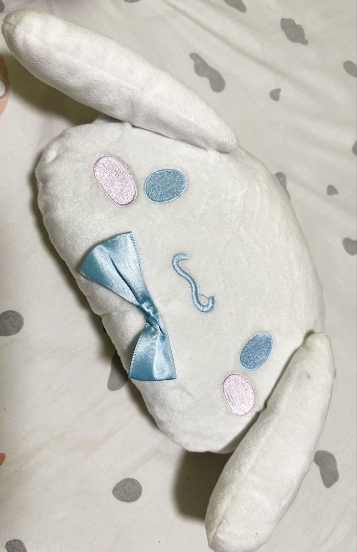 Sanrio Cinnamoroll Plush Shoulder Bag (Category: Babies & Kids Fashion) located in Quezon City. Submitted by pipsqueakscorner (Listing ID 1447427161, Image 1). Description: - Adorable Cinnamoroll plush shoulder bag - Soft white material with embroidered face details - Cute light blue satin bow accent - Light blue fabric lining inside - Features small interior pockets - Secure zipper closure - Approximately 10 inches in length - Ideal for carrying