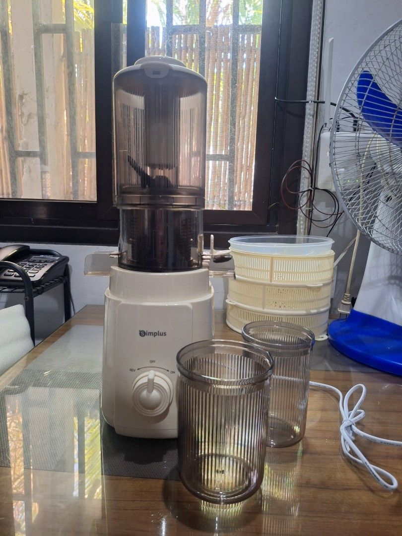 Simplus Juicer with Cups and Pusher (Category: Juicers, Blenders & Grinders) located in Bulacan. Submitted by AshinaKits (Listing ID 1447335370, Image 1). Description: FOR SALE RUSH SIMPLUS JUICER bagong bago binuksan lang. 1.2L Capacity 250ml Juice Collector Capacity 99.8% Juice Purity 113mm Extra wide Feed Chute - Simplus Juicer - Includes 2 cups and pusher - Easy to use with rotating dial settings - Compact design, ideal for small kitchens - S