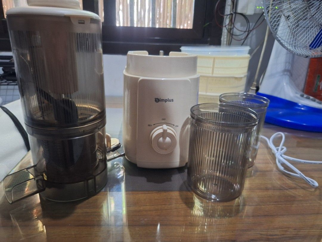 Simplus Juicer with Cups and Pusher (Category: Juicers, Blenders & Grinders) located in Bulacan. Submitted by AshinaKits (Listing ID 1447335370, Image 2). Description: FOR SALE RUSH SIMPLUS JUICER bagong bago binuksan lang. 1.2L Capacity 250ml Juice Collector Capacity 99.8% Juice Purity 113mm Extra wide Feed Chute - Simplus Juicer - Includes 2 cups and pusher - Easy to use with rotating dial settings - Compact design, ideal for small kitchens - S