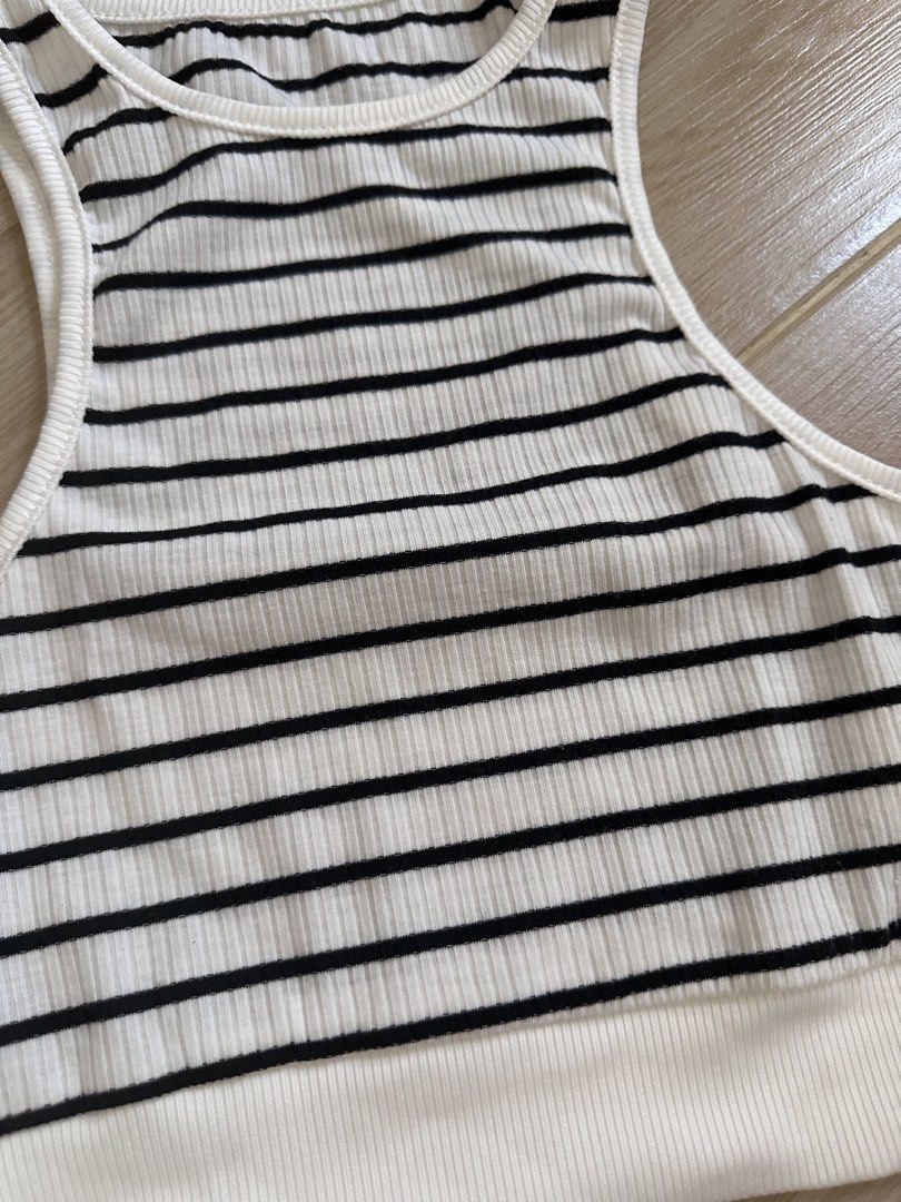 Striped Ribbed Racerback Crop Top (Category: Sleeveless) located in Antipolo. Submitted by waco1313 (Listing ID 1447301167, Image 2). Description: - Black and white striped ribbed crop top - Racerback style with a white band at the bottom - Stretchy and comfortable material - Perfect for casual wear or layering.