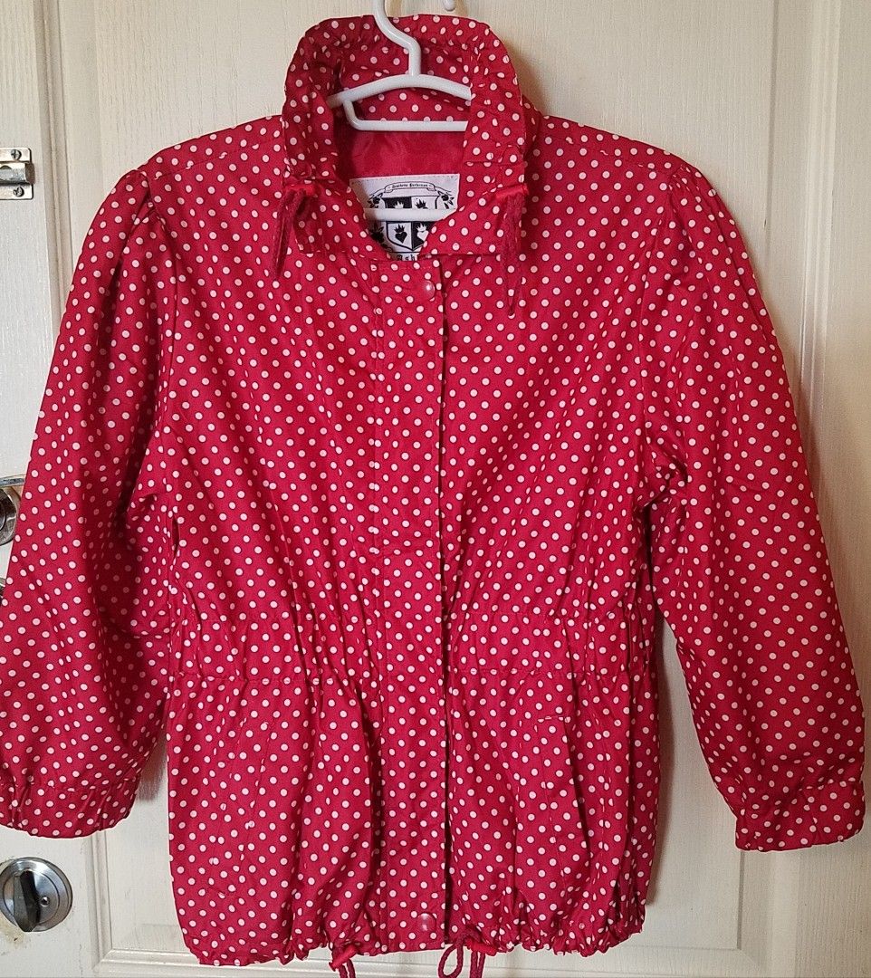 Rain Jacket (windbreaker) w/ drawstring (Teens/Children) (Category: Babies & Kids Fashion) located in Quezon City. Submitted by drkco (Listing ID 1447460412, Image 1). Description: RAINY DAY OOTD❣️ - Very nice red rain jacket with classic white polka dots. - Large on tag, but could also maybe fit a small teen.👍🏻 - Adjustable drawstring at the waist and cuffs for a customized fit. - Convenient zipper closure. - Versatile for casual outfits or as