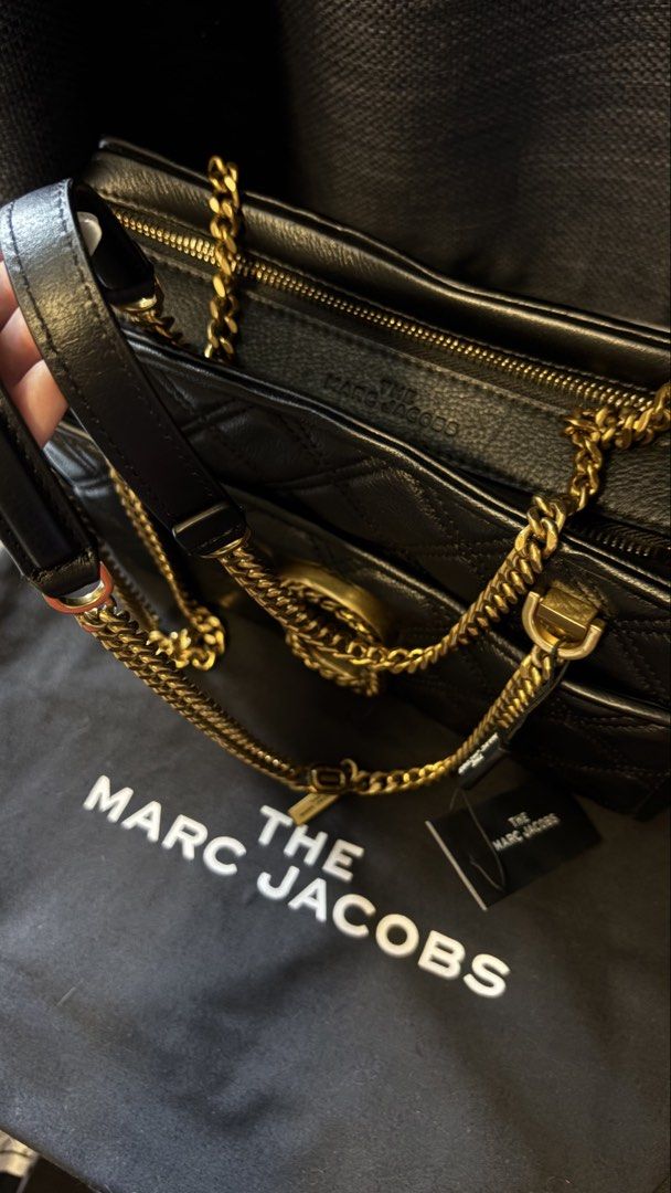 The Marc Jacobs Black Quilted Leather Bag (Category: Luxury Bags & Wallets) located in San Juan City. Submitted by xiaolongbaebyg (Listing ID 1447295502, Image 3). Description: Marc Jacobs “The Status” shoulder bag in Black, quilted leather and gold-toned chain hardware. BRAND NEW with tag, dust bag, and care card $595 og price.