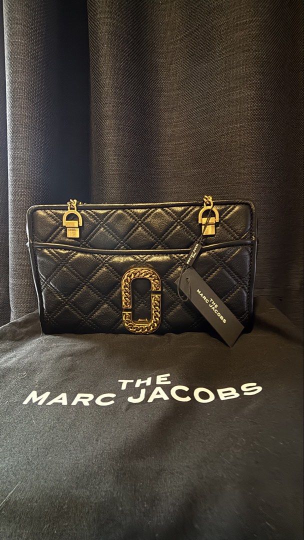 The Marc Jacobs Black Quilted Leather Bag (Category: Luxury Bags & Wallets) located in San Juan City. Submitted by xiaolongbaebyg (Listing ID 1447295502, Image 2). Description: Marc Jacobs “The Status” shoulder bag in Black, quilted leather and gold-toned chain hardware. BRAND NEW with tag, dust bag, and care card $595 og price.