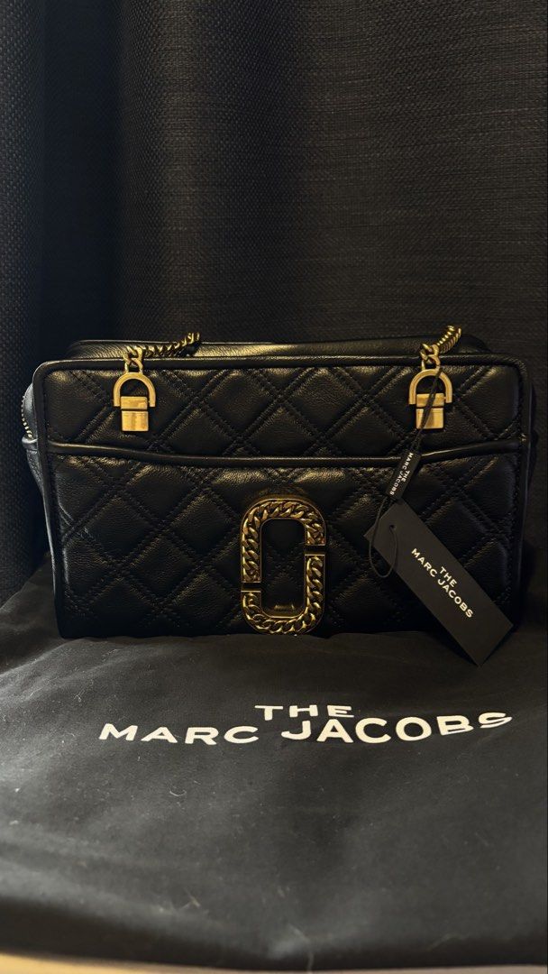 The Marc Jacobs Black Quilted Leather Bag (Category: Luxury Bags & Wallets) located in San Juan City. Submitted by xiaolongbaebyg (Listing ID 1447295502, Image 1). Description: Marc Jacobs “The Status” shoulder bag in Black, quilted leather and gold-toned chain hardware. BRAND NEW with tag, dust bag, and care card $595 og price.