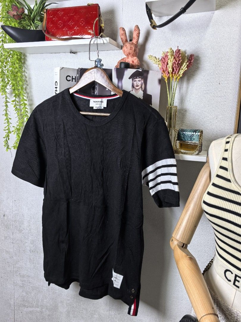 Thom Browne tshirt (Category: Luxury Apparel) located in Baguio. Submitted by ashzachary (Listing ID 1447427010, Image 1). Description: Thom Browne tshirt Condition :Excellent condition Color rate 10/10 Size : Medium Inches:W19/L28. 5 No issues No flaws Super ganda sa personal Pm. More details Good quality Plsss 📌No Bogus 📌No return MOP What you see is what you get PALAWAN, CEBUNA GCASH AND BDO Reminder😊 We're selling thrifted clothes so pleas