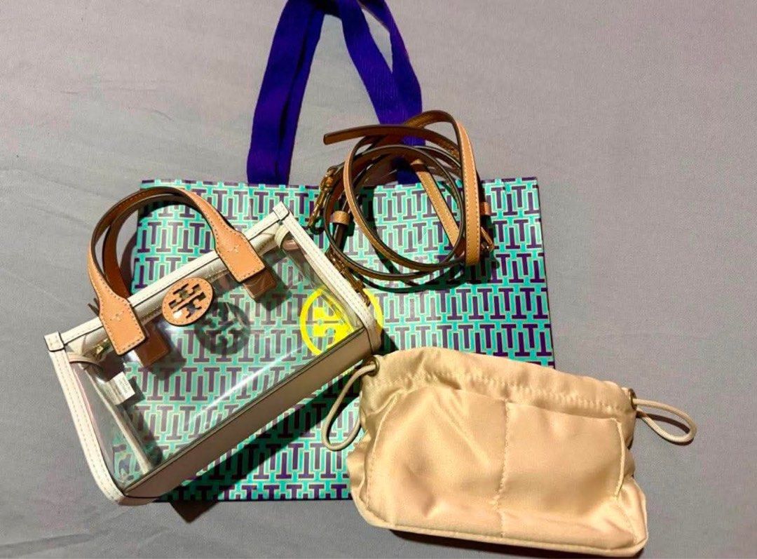 Tory Burch Mini Ella Cross-Body Bag (Category: Luxury Bags & Wallets) located in Manila. Submitted by ceeej04 (Listing ID 1447440152, Image 1). Description: -Authentic Tory Burch Mini Ella -white and tan in color -Clear PVC Vinyl - gold Zip closure - adjustable removable cross body strap 23.1" - height 4.8", length 7.2" , depth 2.8" -with FREE insert pouch (para ndi kita loob) bought from orange app 600 pesos only used once - ndi ko nagagamit kas