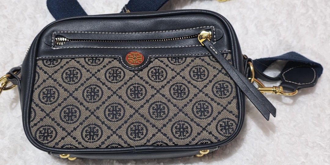 Tory Burch T Monogram Jacquard Camera Bag (Category: Luxury Bags & Wallets) located in Malolos. Submitted by candyproj (Listing ID 1447442975, Image 2). Description: This stylish camera bag features a classic woven jacquard pattern inspired by traditional quilting, paired with fine navy leather trim and distinct gold-tone hardware. Good condition RFS: Decluterring/Migrating Price is Negotiable FREE SHIPPING.