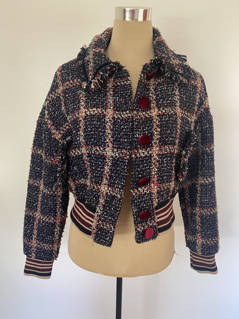 Tweed Plaid Bomber Jacket with Velvet Buttons (Category: Coats, Jackets and Outerwear) located in Santa Rosa. Submitted by summerbrunch (Listing ID 1447469629, Image 3). Description: BUY WORTH 1K, GET FREE SHIPPING! EXCEPT FOR STROLLER BAG Mannequin Size: MEDIUM has 2 side pockets all buttons working full inner lining - Navy blue tweed bomber jacket - Plaid pattern with red, green, and white threads - Velvet buttons down the front - Ribbed cuffs 