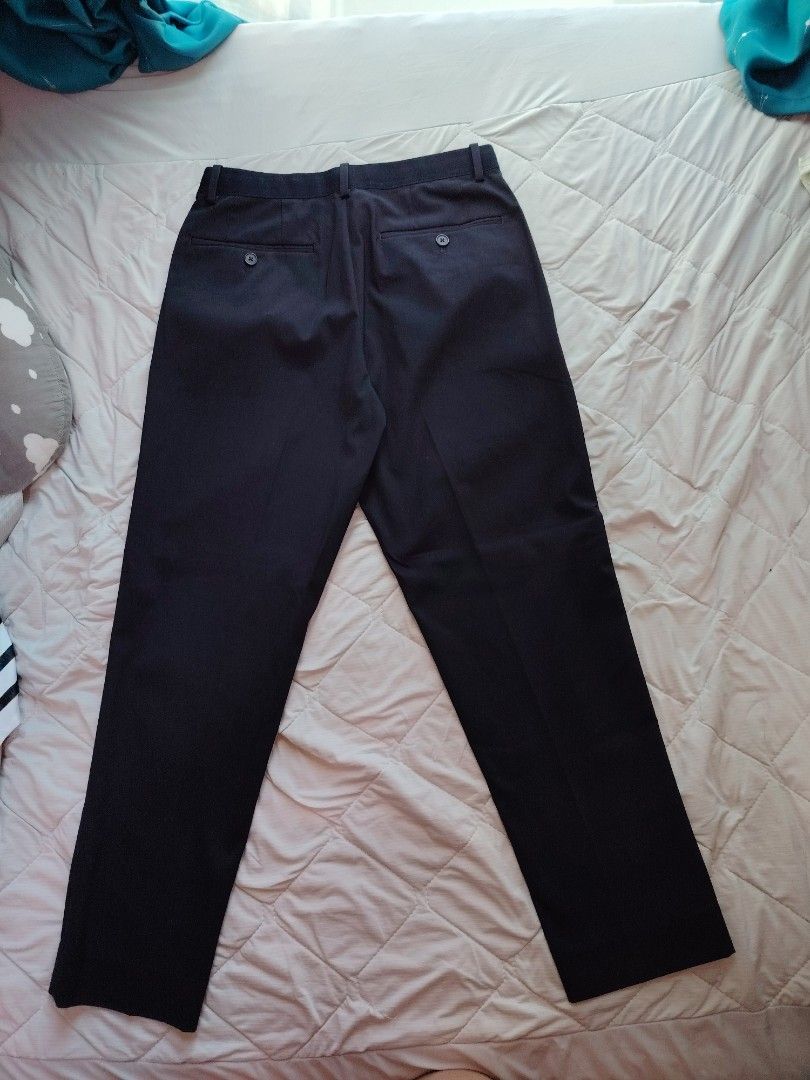 Uniqlo Pants Navy Size S (Category: Trousers) located in Makati City. Submitted by jayclutter0976004 (Listing ID 1447308334, Image 3). Description: - Uniqlo Navy Blue Pants - Size: S (fits waist 68-76 cm) - Material: Polyester, Rayon, Spandex blend - Features: Comfortable stretch fabric - Style: Perfect for casual or smart casual outfits - Origin: Made in Bangladesh - Condition: Please check photos for details.