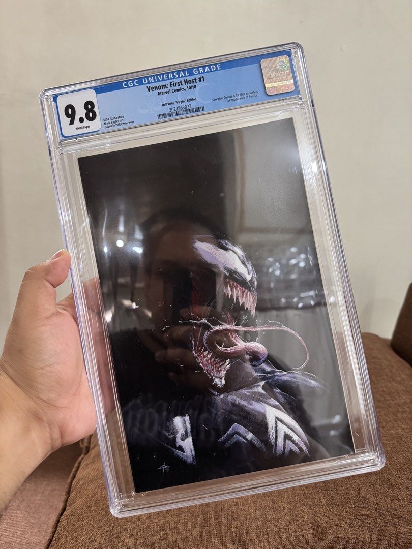 Venom: First Host #1 CGC 9.8 "Virgin" Edition Marvel Comics (Category: Comics & Manga) located in Pateros City. Submitted by lacasadekartonph (Listing ID 1447469591, Image 1). Description: - Comic: Venom: First Host #1 - Edition: Virgin Variant - Publisher: Marvel Comics - Release Date: October 2018 - Grading Company: CGC - Grade: 9.8 (Universal Grade) - Condition: Near Mint/Mint - Perfect for any serious comic collector!.