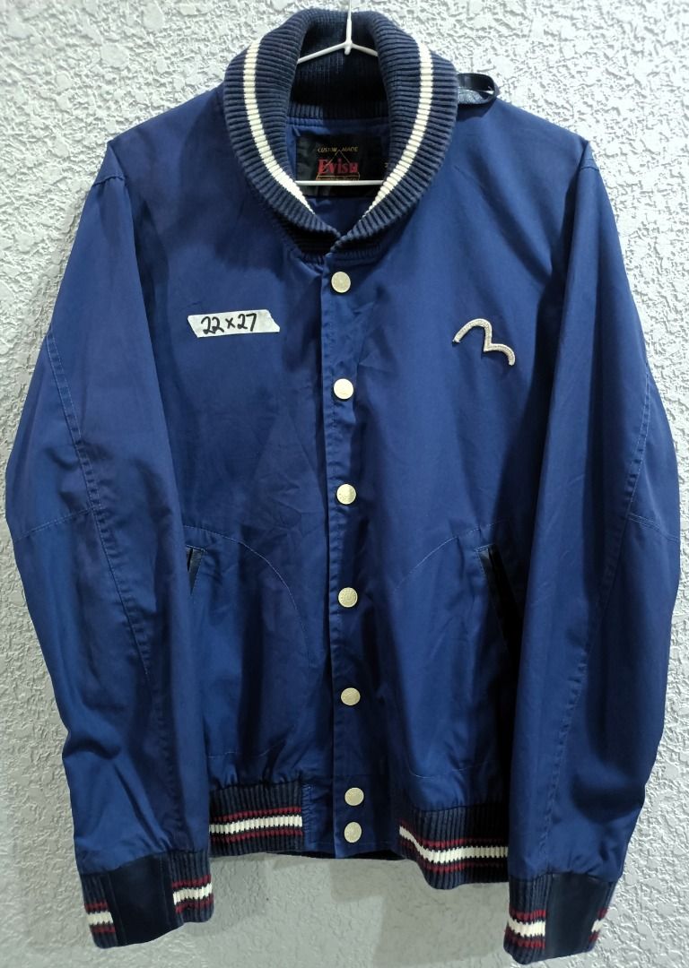 (PRICE DROP) - VINTAGE EVISU HIGH-COLLAR BOMBER JACKET (Category: Coats, Jackets and Outerwear) located in Calamba. Submitted by rootsph (Listing ID 1447450836, Image 1). Description: Details: Fits Large. Leather on the collar, ribbings, and pockets. Has a secret pocket at the back right side. Dimes: 22W x 27L Color: Blue Condition: Excellent, no issue, complete tags Please manage your expectation, item being sold is preloved and not brand new un
