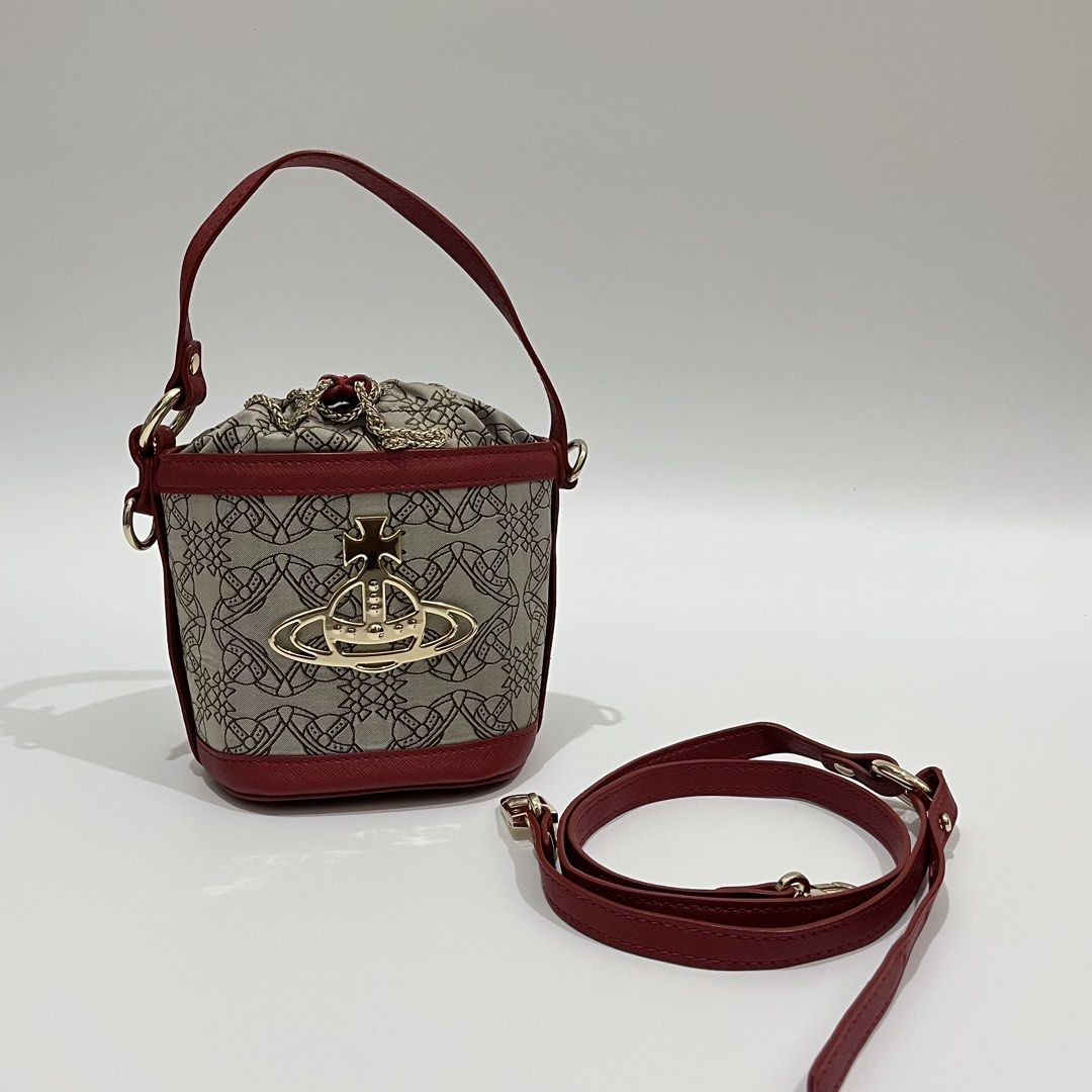 VIVIENNE WESTWOOD - DAISY SMALL DRAWSTRING BUCKET BAG (Category: Luxury Bags & Wallets) located in Lucena. Submitted by southsidekartell (Listing ID 1447410097, Image 1). Description: IN GREAT CONDITION NO MAJOR ISSUES VIVIENNE WESTWOOD VEGAN .