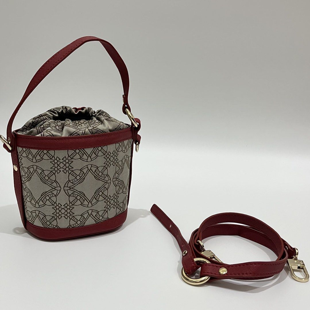 VIVIENNE WESTWOOD - DAISY SMALL DRAWSTRING BUCKET BAG (Category: Luxury Bags & Wallets) located in Lucena. Submitted by southsidekartell (Listing ID 1447410097, Image 2). Description: IN GREAT CONDITION NO MAJOR ISSUES VIVIENNE WESTWOOD VEGAN .