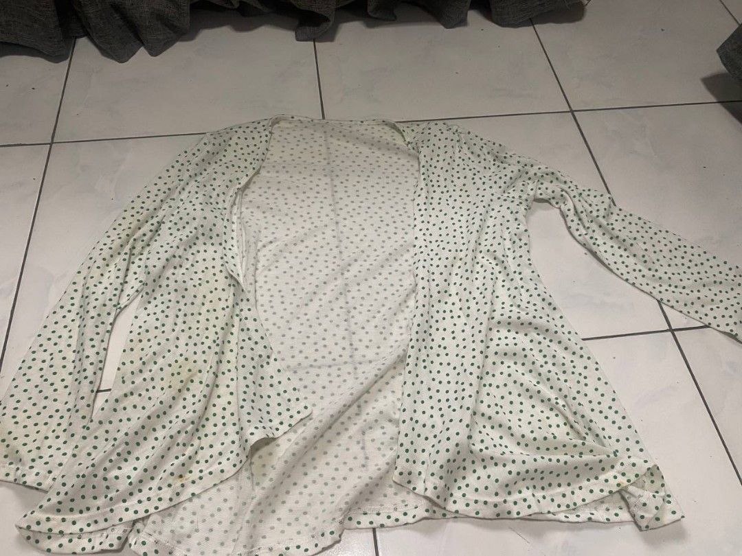 White Cardigan with Green Polka Dots (Category: Coats, Jackets and Outerwear) located in Cavite. Submitted by breadandbutter00 (Listing ID 1447348922, Image 1). Description: - White cardigan with a cute green polka dot pattern. - Long sleeves and an open front design. - Made from lightweight and flowy fabric. - Features a few faint yellow stains on the front (please check photos for details). - Ideal for stylish layering over your favorite tops..