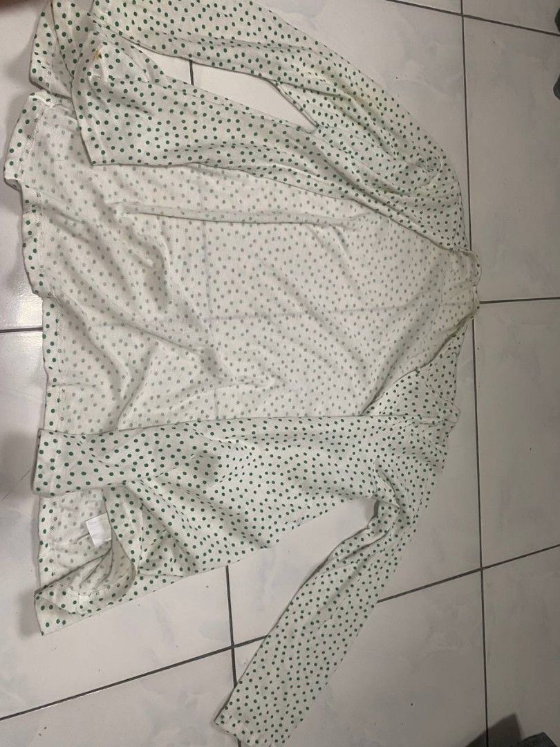 White Cardigan with Green Polka Dots (Category: Coats, Jackets and Outerwear) located in Cavite. Submitted by breadandbutter00 (Listing ID 1447348922, Image 3). Description: - White cardigan with a cute green polka dot pattern. - Long sleeves and an open front design. - Made from lightweight and flowy fabric. - Features a few faint yellow stains on the front (please check photos for details). - Ideal for stylish layering over your favorite tops..