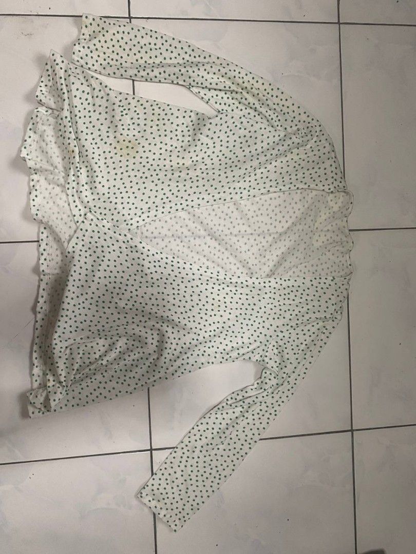 White Cardigan with Green Polka Dots (Category: Coats, Jackets and Outerwear) located in Cavite. Submitted by breadandbutter00 (Listing ID 1447348922, Image 2). Description: - White cardigan with a cute green polka dot pattern. - Long sleeves and an open front design. - Made from lightweight and flowy fabric. - Features a few faint yellow stains on the front (please check photos for details). - Ideal for stylish layering over your favorite tops..