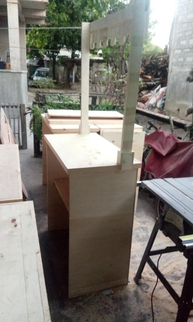 Wooden Stall Counter with Canopy (Category: Tables & Sets) located in San Juan City. Submitted by frugalmomph (Listing ID 1447387209, Image 2). Description: 6 units available - Sturdy wooden stall counter - Built-in storage cabinet with doors - Features a canopy structure - Ideal for markets, bazaars, and events - Constructed from durable plywood - Blank canvas for your customization RFS: upgrade.