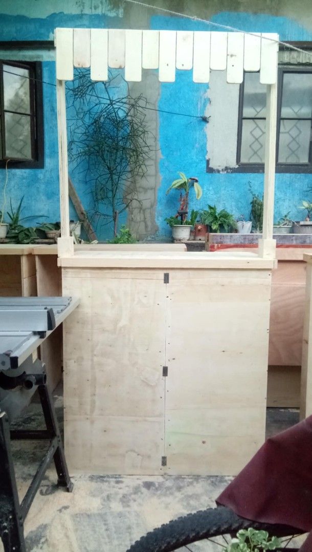 Wooden Stall Counter with Canopy (Category: Tables & Sets) located in San Juan City. Submitted by frugalmomph (Listing ID 1447387209, Image 1). Description: 6 units available - Sturdy wooden stall counter - Built-in storage cabinet with doors - Features a canopy structure - Ideal for markets, bazaars, and events - Constructed from durable plywood - Blank canvas for your customization RFS: upgrade.