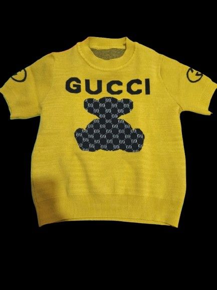 Yellow Gucci Teddy Bear Sweater (Category: Luxury Apparel) located in Quezon City. Submitted by acxsty (Listing ID 1447386305, Image 1). Description: - Adorable yellow sweater for kids - Features iconic Gucci logo - Fun teddy bear graphic - Short sleeves, perfect for warmer weather - A playful addition to any child's wardrobe.