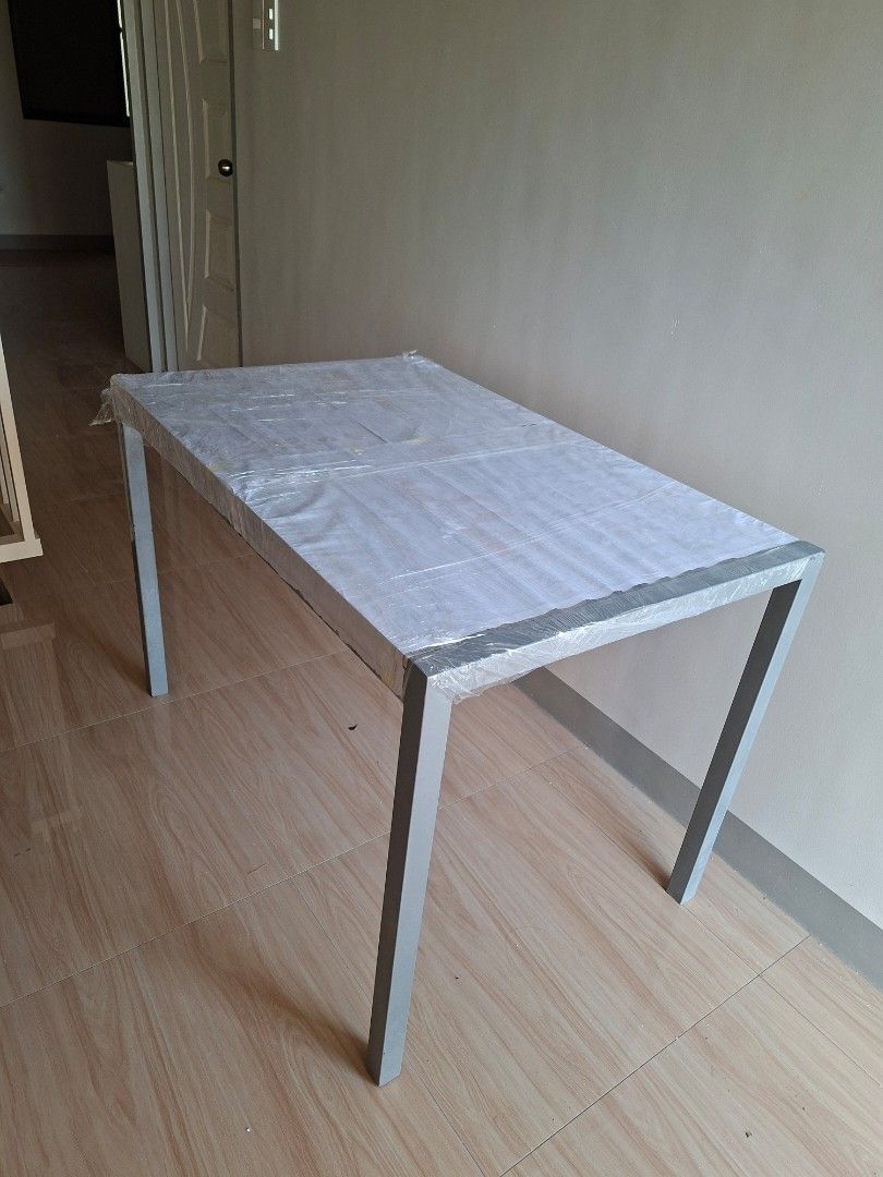4 seater Dining Set (Heavy Duty) (Category: Tables & Sets) located in Paranaque City. Submitted by jogotas (Listing ID 1452710518, Image 1). Description: - Includes 4 chairs and a 4-seater table - Table top is made from wood while the frames are made from steel - Signs of usage - Items are covered in plastic already and ready for shipment - Last picture is the design of the table top underneath the cover RFS: Moving Out Still very negotiable.