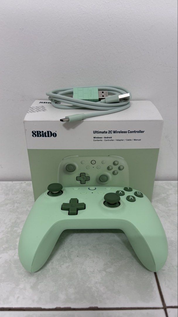 8BITDO Ultimate 2C Wireless Controller (Category: Controllers) located in Kuala Lumpur. Submitted by thisisndzem (Listing ID 1452716039, Image 1). Description: **What’s in the Box:** - 1 x 8BitDo Ultimate 2C Wireless Controller - 1 x 2.4G Wireless Receiver - 1 x USB-C Cable - 1 x Instruction Manual **Features:** - **1000Hz Polling Rate:** Achieve ultra-responsive gameplay with low-latency performance, ensuring you never miss a move. - **Hall Effe