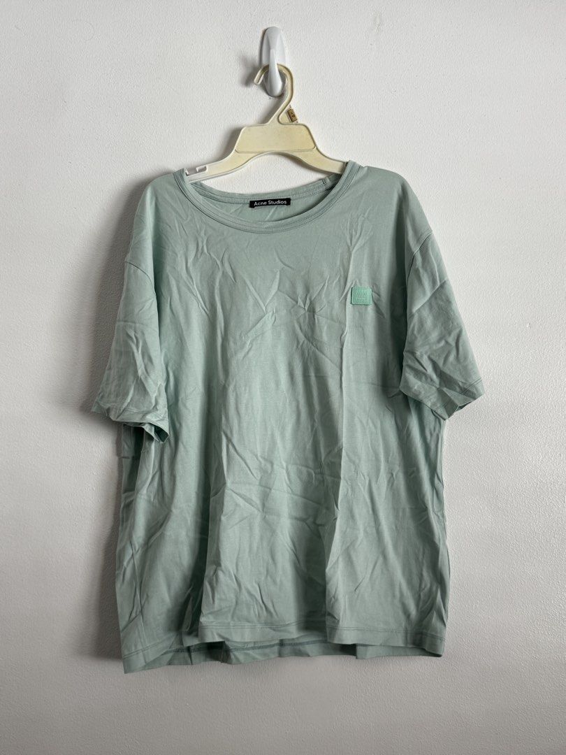 Acne Studios Face Patch T-Shirt Mint Green (Category: Tshirts & Polo Shirts ) located in Pasig City. Submitted by archive.project (Listing ID 1452772977, Image 1). Description: - Acne Studios t-shirt - Mint green color - Iconic face patch on chest - Relaxed fit - Soft, comfortable cotton material - Versatile for everyday styling 1,200.